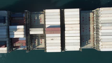 Drone-shot-directly-above-a-shipping-container-preparing-for-voyage