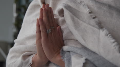 A-meditating-woman-holding-her-hands-together