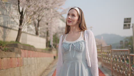 Attractive-Caucasian-Lady-Walking-At-Yangjae-Citizen's-Forest-Park-In-Seocho-District,-Seoul-City,-South-Korea