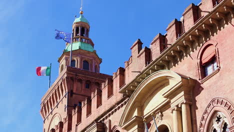 The-Italian-flag-and-the-European-flag-flying-on-the-clock-tower-of-Bologna