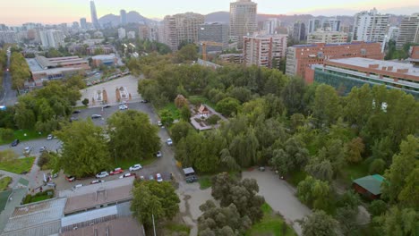 Aerial-view-circling-the-Plaza-Tailandia,-sunny-evening-in-Santiago-de-Chile