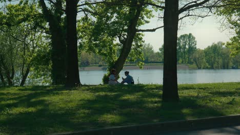 Peaceful-Lakeside-Conversation-of-Two-People-at-lake
