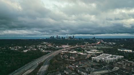 Traffic-At-Northeast-Expressway-With-Downtown-Atlanta-Skyline-In-The-Distance-In-Georgia,-USA