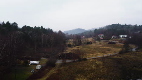 Aerial-View-over-Orust-Countryside-with-Scattered-Villas-a-misty-day,-Sweden,-Drone-Footage