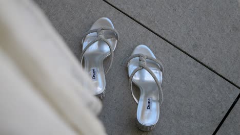 Seen-over-the-bride's-dress-on-the-gray-wedding-summer-shoes,-they-look-very-beautiful
