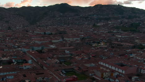 Panoramic-Aerial-View-Of-Historical-City-Center-Of-Cusco-During-Sunset-In-Peru