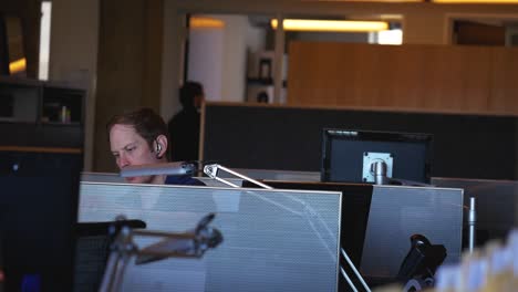 Panning-shot-of-a-employee-working-in-the-office