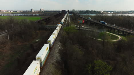 Intermodal-Freight-Transport---Train-With-Long-Cargo-Containers-Traveling-Through-Railroad-to-West-Memphis-In-Arkansas