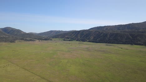 Aerial-View-Of-Mountain-Range-And-Green-Grassland-In-Daytime-In-San-Diego,-California,-USA
