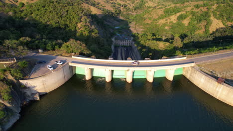 Driving-car-on-dam-bridge-of-reservoir-lake-in-Tropical-landscape-of-Dominican-Republic