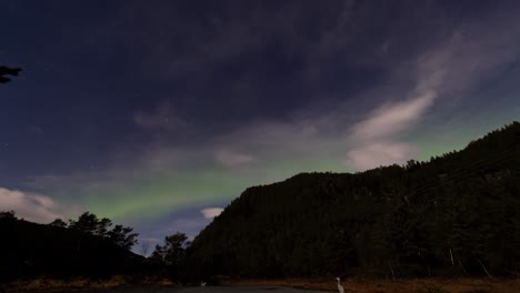 Northern-lights-Aurora-Borealis-in-red-and-green-over-West-Norway,-time-lapse