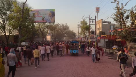 pov-shot-Through-this-attraction-and-entertainment-happening-in-the-market,-the-waste-temple-employees-are-voluntarily-taking-up-the-cleaning-campaign-and-cleaning-the-market