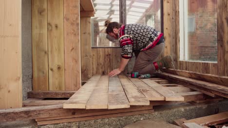 Installing-Wooden-Floor-Inside-The-Greenhouse-In-The-Farm