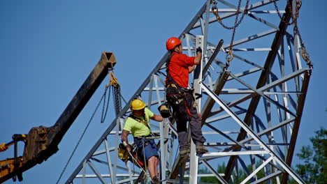 Construction-crew-putting-up-a-5G-high-capacity-transmission-lattice-tower