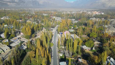 Drone-shot-of-Skardu-city-with-busy-road-in-Pakistan-during-sunny-day