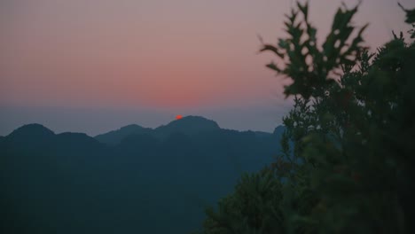 Sunrise-through-limestone-mountains-at-Cat-Ba-island-of-Vietnam