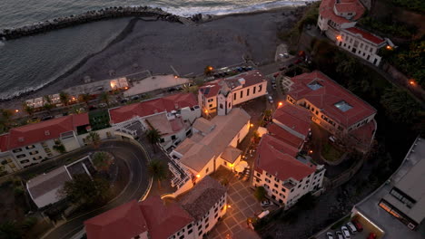 dawn-at-Ponta-do-Sol,-evening-aerial-colorful-beach-village,-Madeira,-Portugal