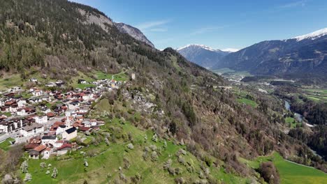 Beautiful-Swiss-Town-on-green-slope-of-mountain