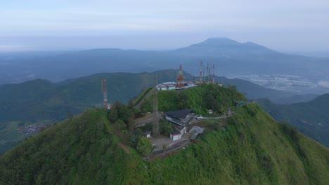 Mountain-top-with-many-5G-towers-in-Indonesia,-aerial-drone-view