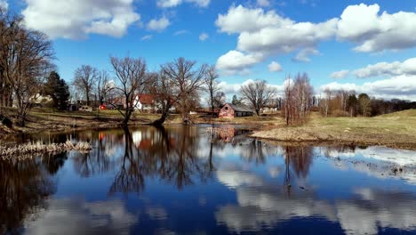 Village-Houses-By-The-Lake-In-Valmiera,-Vidzeme,-Latvia