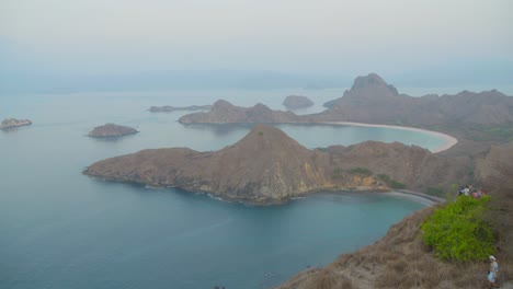 Bay-of-Padar-island-in-Komodo-National-Park-seen-from-promontory-on-misty-day-during-twilight,-Indonesia