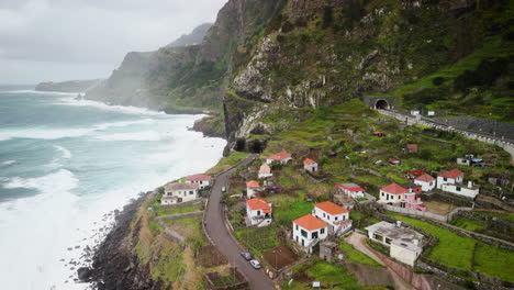 Sao-Vicente-seashore-mountainvillage,-establishment-shot-by-drone-overview,-Madeira-aerial-view
