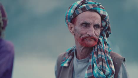 Closeup-shot-of-an-old-Pakistani-man-with-red-beard-in-Balochistan,-Pakistan