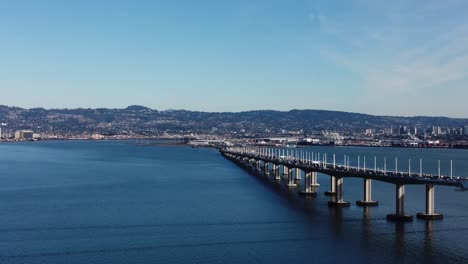 Drone-Footage-of-the-San-Francisco-Bay-Bridge-taken-from-Treasure-Island,-California