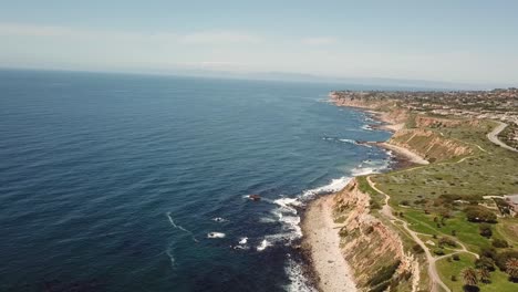 4K-Drone-Shot-of-Breathtaking-Pacific-Ocean-Views-with-Cliffs-in-Palos-Verdes,-Los-Angeles,-California-on-a-Warm,-Sunny-Day