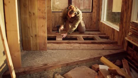 Man-Putting-Wooden-Floor-Inside-The-Greenhouse