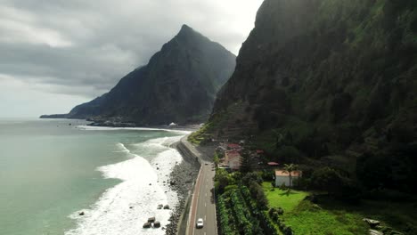 Drone-View-of-Scenic-Ocean-Drive,-Huge-Steep-Mountains-and-Coastline,-Madeira-4k