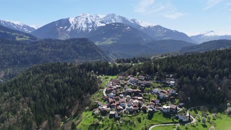 Trin-Town-in-Switzerland-surrounded-by-forest-trees-in-spring