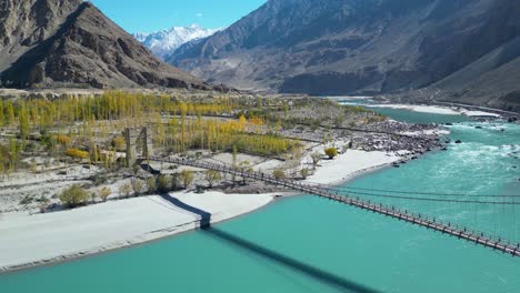 Aerial-view-of-a-wooden-bridge-outside-Skardu,-a-city-in-northern-Pakistan