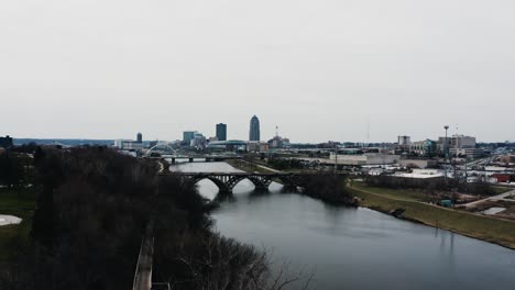 Drone-shot-of-bridges-crossing-over-the-Des-Moines-River-in-Iowa