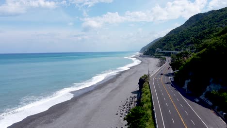 Highway-by-the-sea-and-driving-cars-in-a-tropical-country