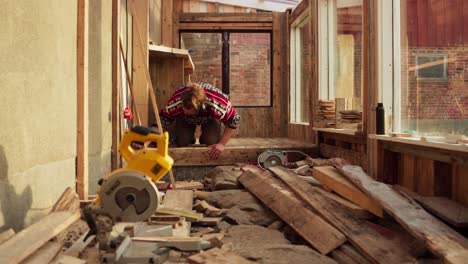 Caucasian-Guy-Is-Busy-Working-Inside-The-Wooden-Interior-Of-A-Greenhouse