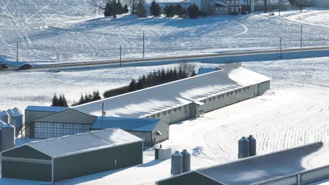 Barns-at-American-farm-covered-in-snow-during-winter