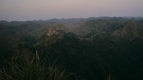 Aerial-shot-of-green-limestone-mountains-in-Cat-Ba-island-during-sunny-day-in-Vietnam