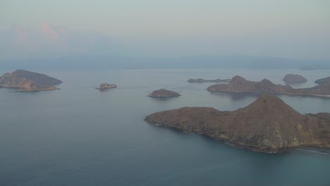 Bay-of-Padar-or-Pada-island-seen-from-promontory-on-misty-day-during-twilight,-Indonesia