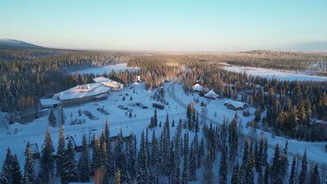 Aerial-drone-footage-of-Luosto,-Finland,-in-Lapland-the-Arctic-Circle-during-winter