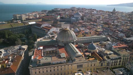 Amazing-Drone-View-Above-Galleria-Umberto-I,-Aerial-Pullback-Reveals-Major-Tourist-Destination-in-Naples,-Italy