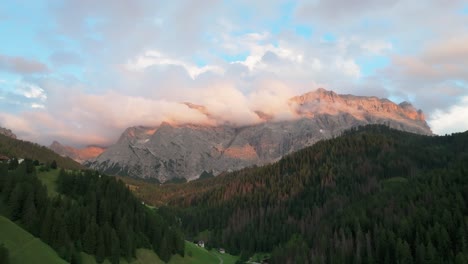 An-evening-aerial-footage-of-the-Sas-dles-Nü-mountain-covered-in-beautiful-clouds