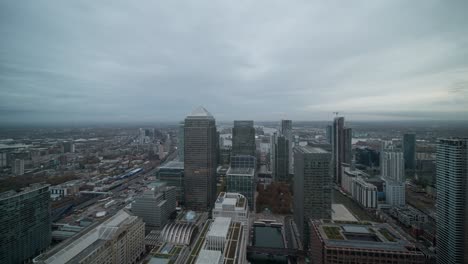 Timelapse-of-Canary-Wharf-skyscrapers-from-day-to-night-on-a-cloudy-day-in-wide-angle
