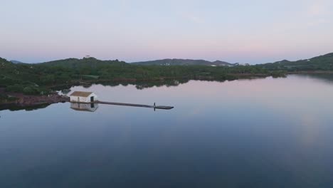 Mediterranean-lonely-location-solitude-at-Fornells-bay-at-Menorca,-aerial-drone-zooming-out-wide-view