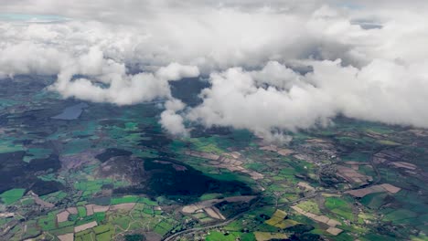 A-4K-flight-over-Irelands-green-fields-dropping-through-clouds