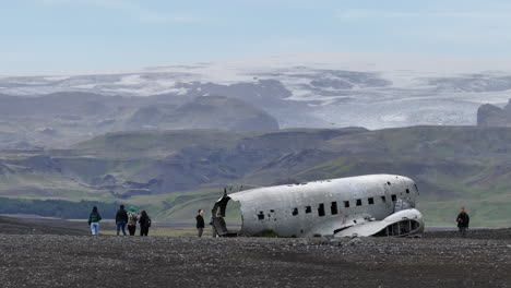 Drone-Shot-of-Abandoned-US-Navy-Airplane-on-Iceland-With-GLacier-and-Hills-in-Background