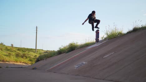 Person-lands-a-skateboard-trick-in-a-ditch-on-Maui