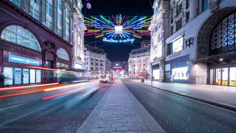 Time-lapse-of-traffic-at-Oxford-Street-at-night-with-Christmas-illuminations-on-the-junction-with-Regents-Street
