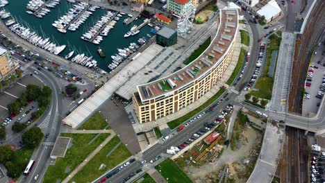 Aerial-view-over-the-port-and-the-coast-of-Savona,-Italy---tilt,-drone-shot