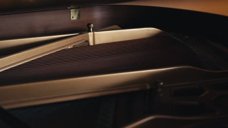 a-tight-shot-of-the-interior-of-a-grand-piano-showing-the-strings